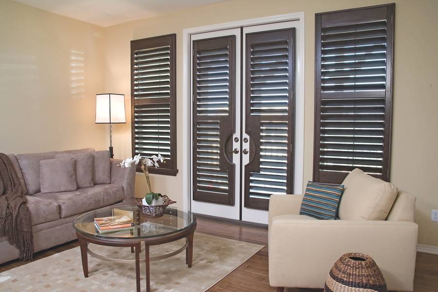 inside decorative brown shutters fitted by the shutter company