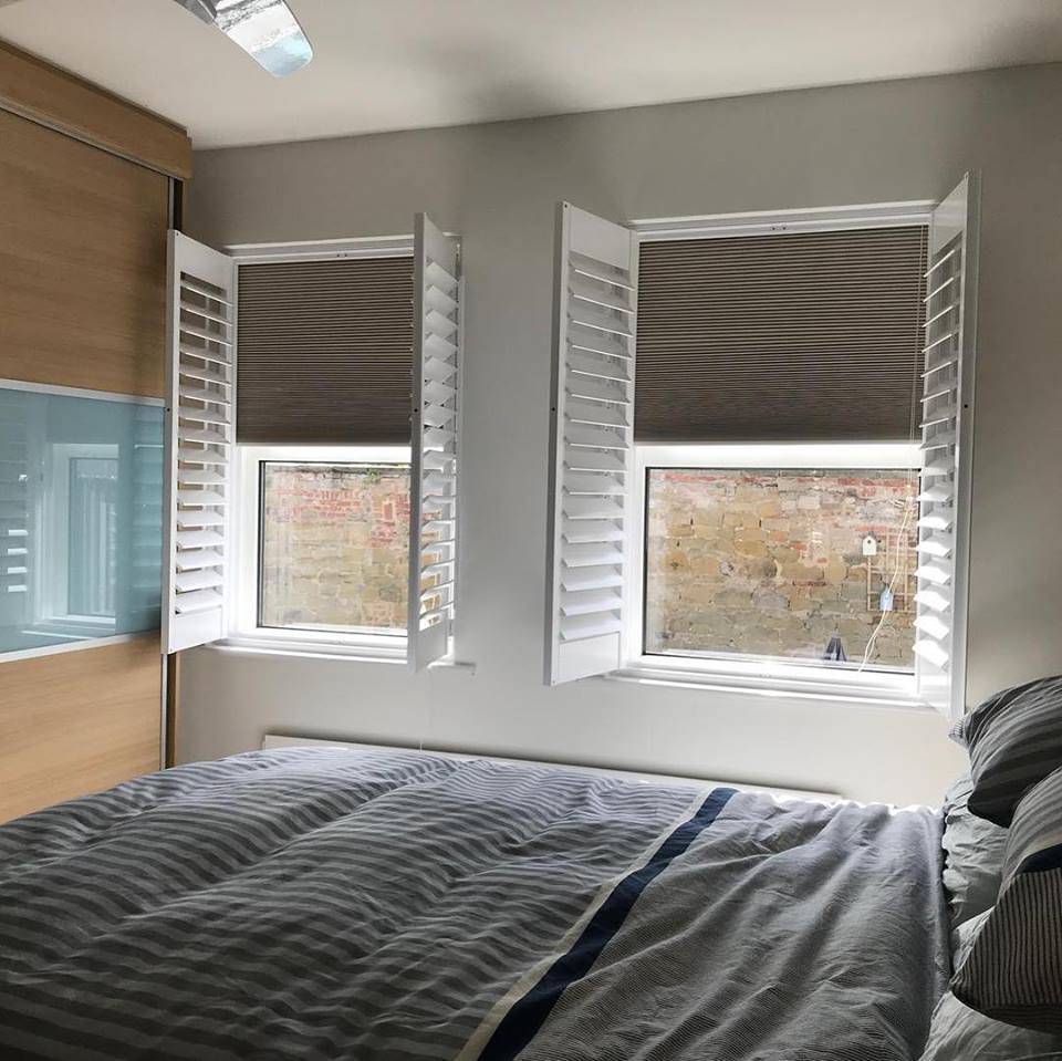 open shutter and shade blinds bedroom