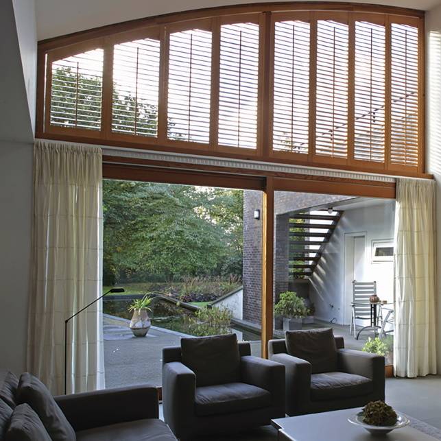 brown window shutter for upper window