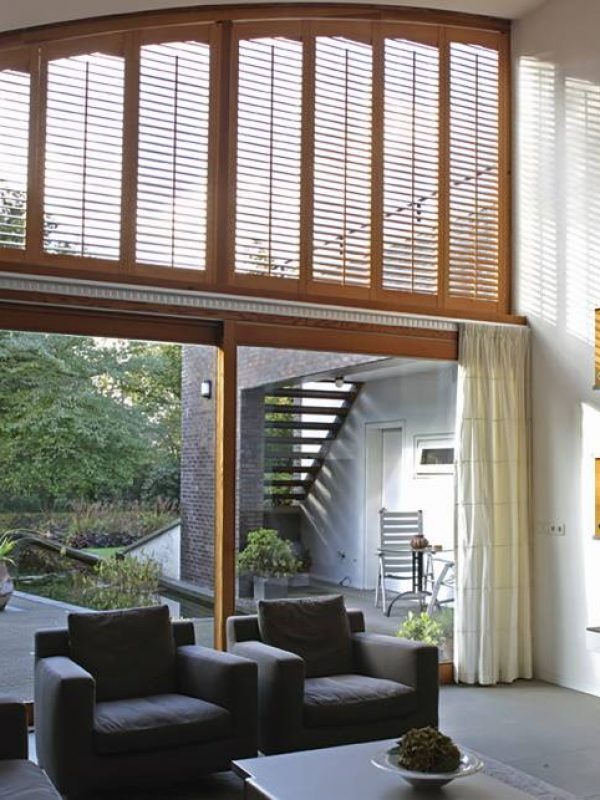 Brown shutter blind for large window the shutter company