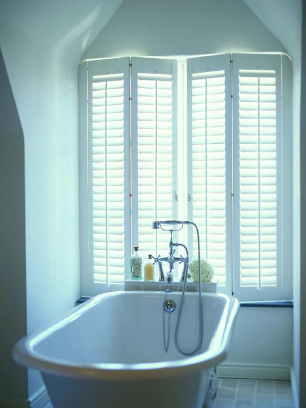 Italian style white window shutters in modern bathroom