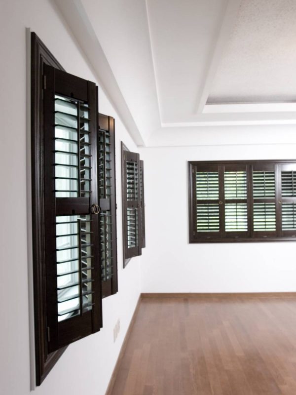 Brown full height shutters in a hallway
