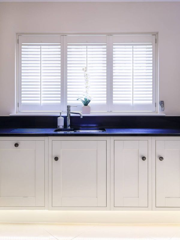 white shutter blinds in white wall kitchen